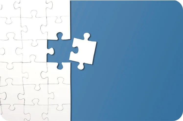 Jigsaw puzzle with the last piece being put in place